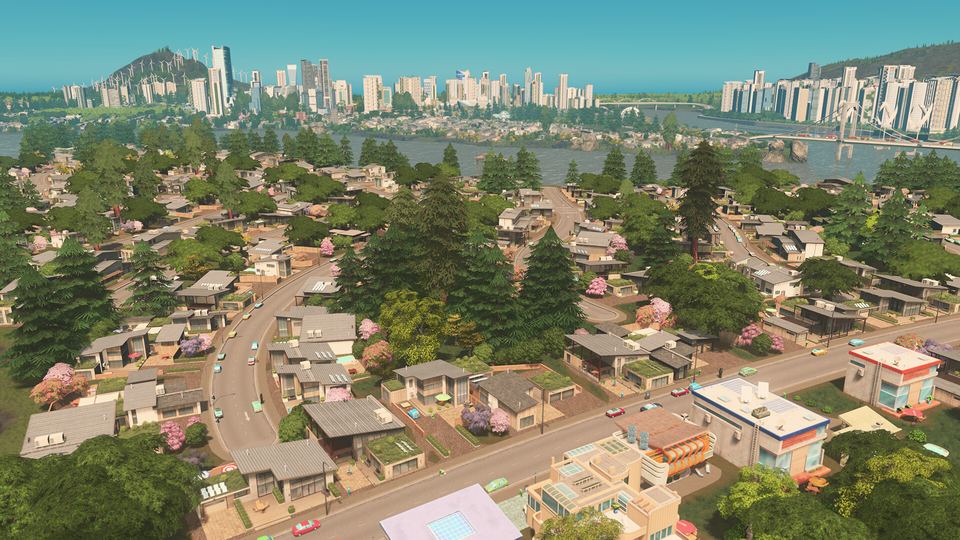Cities: Skylines のゲーム画面。住宅街の向こうに高層ビルが並ぶ街並み
