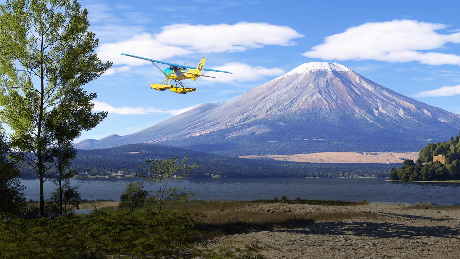 富士山と湖の前を飛ぶ黄色い水上機